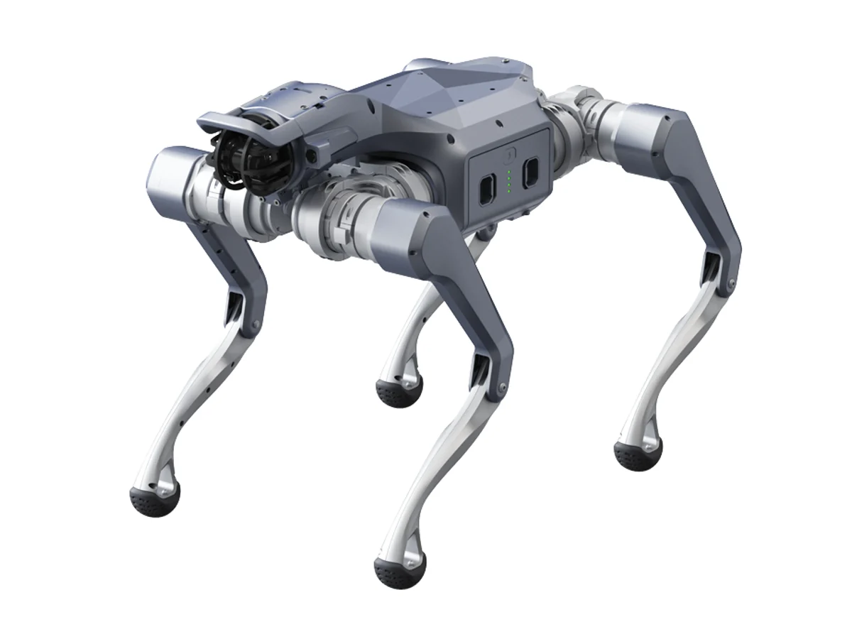 The Unitree As2: a compact four-legged robot with a silver body, exposed joint motors and a caged lidar sensor at the front.
